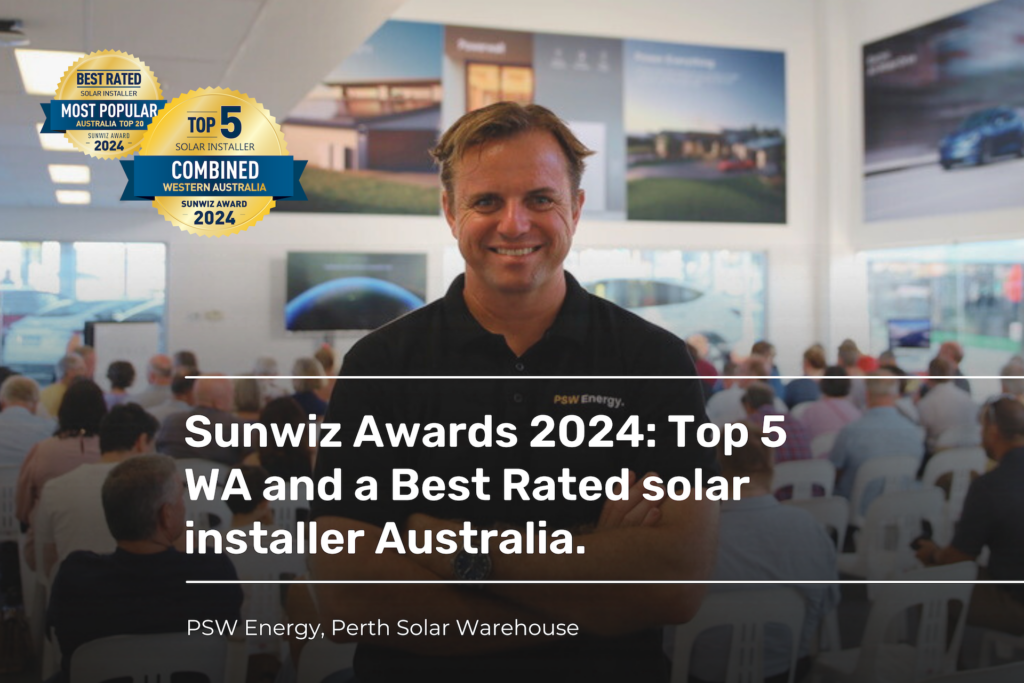 Sunwiz Awards 2024 with Derek McKercher in the foreground standing infront of a room full of people with arms crossed and smiling. Sunwiz Awards logos featured in the top left corner