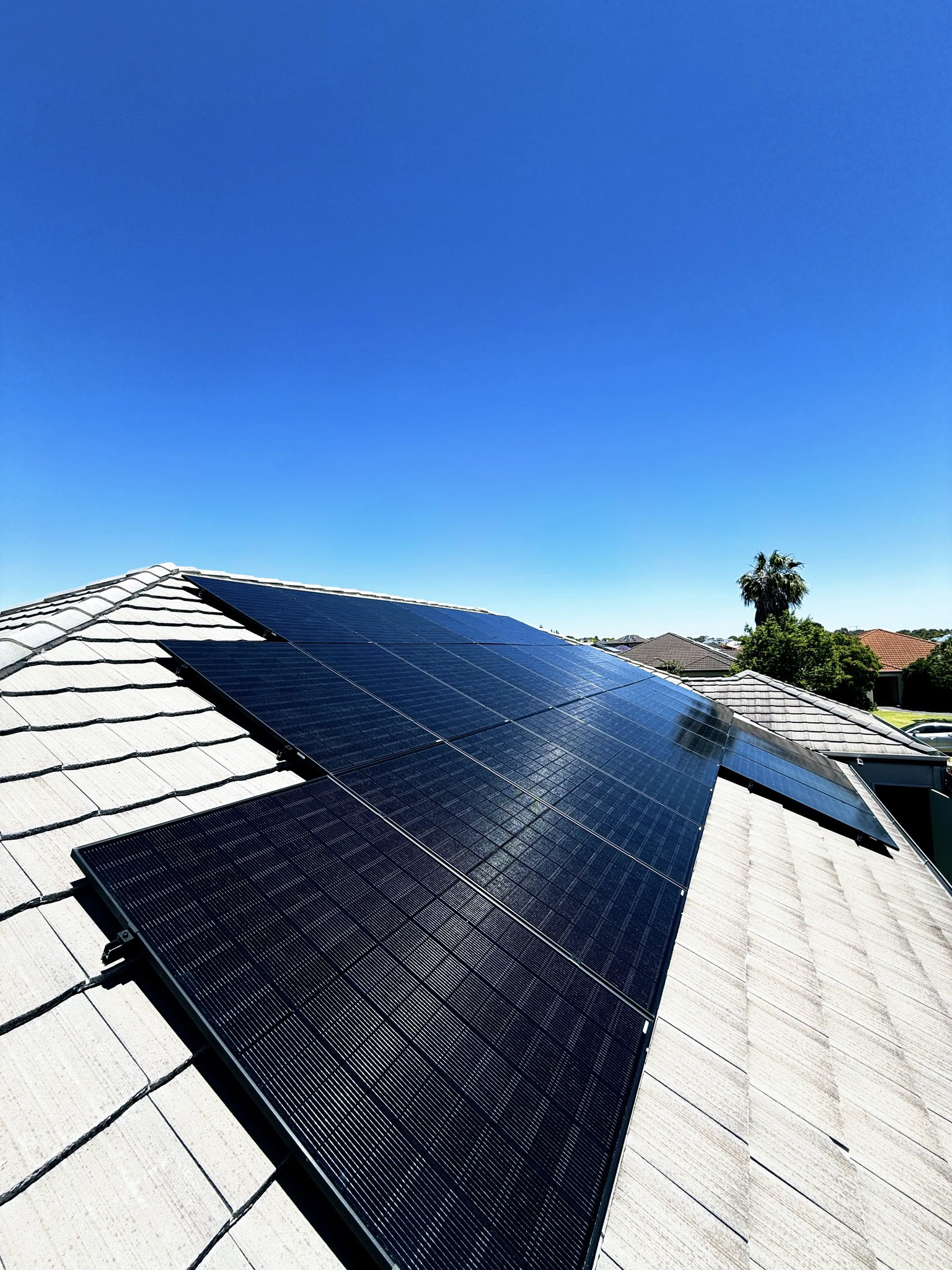 Jinko Neo Satin all-black solar panels installed by Perth Solar Warehouse on a suburban tile rooftop in Darch, Western Australia.