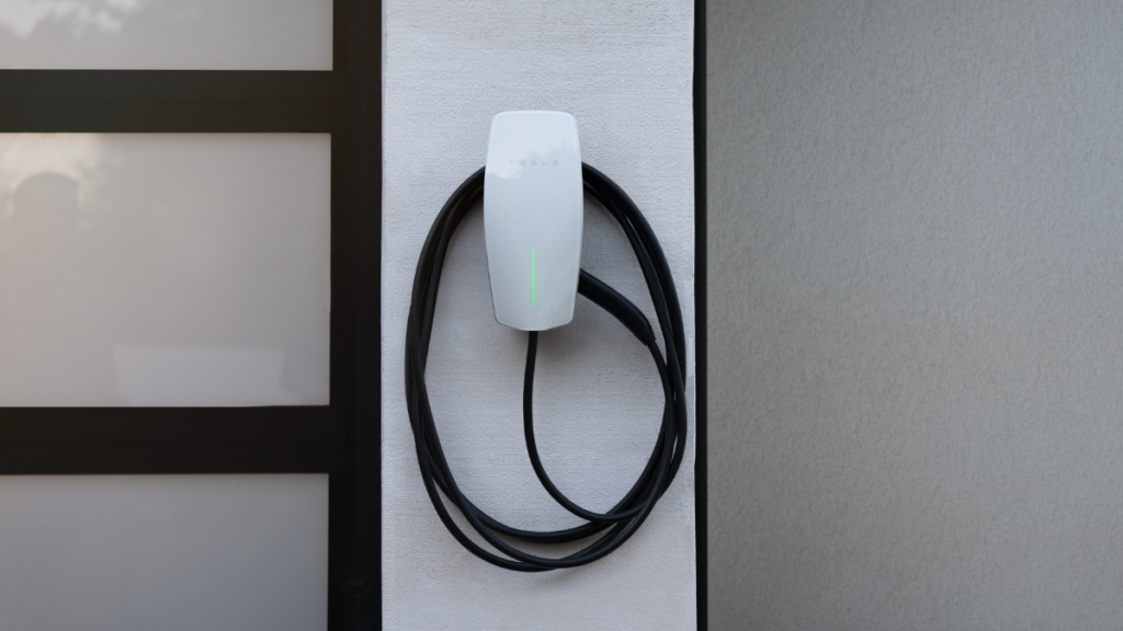 Tesla wall connector mounted on wall